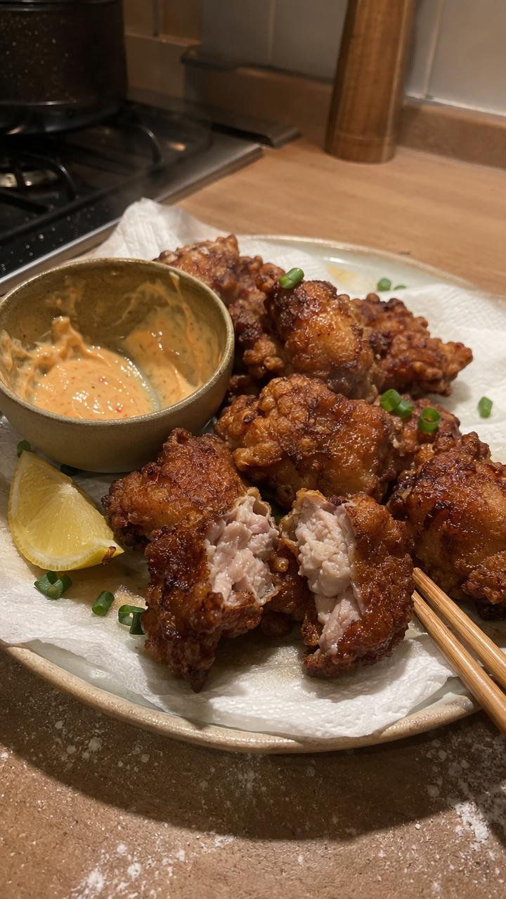 Golden Japanese karaage with a craggy crisp coating and a lemon wedge